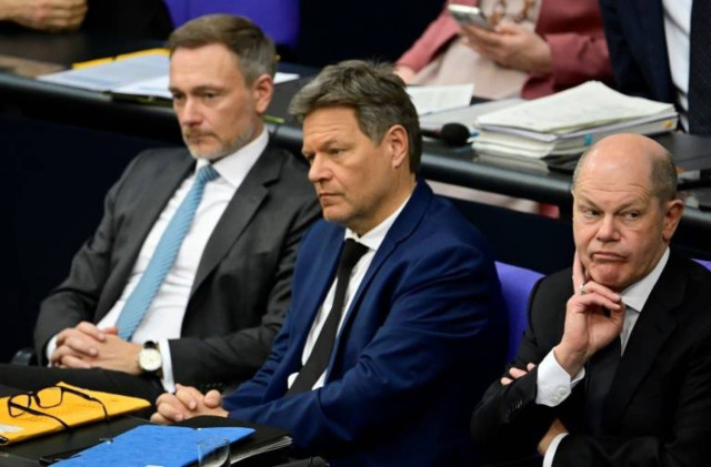 Picture of FDP Finance Minister Christian Lindner (L), Greens Economy Minister Robert Habeck (C) and Chancellor Olaf Scholz (R) of the SPD are locked in a budget dispute